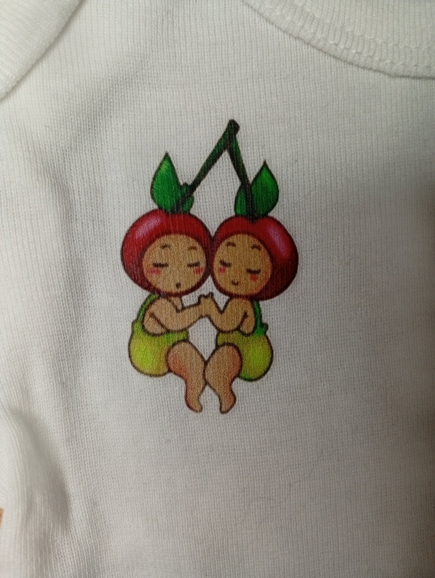 Cute cherry twins illustration on white fabric, baby clothing design