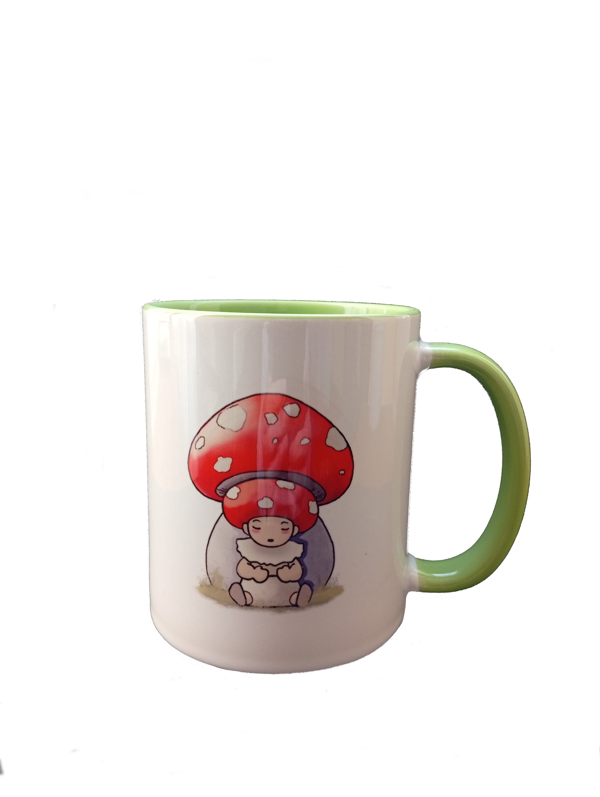 White ceramic mug with green handle, featuring a cute cartoon mushroom character illustration