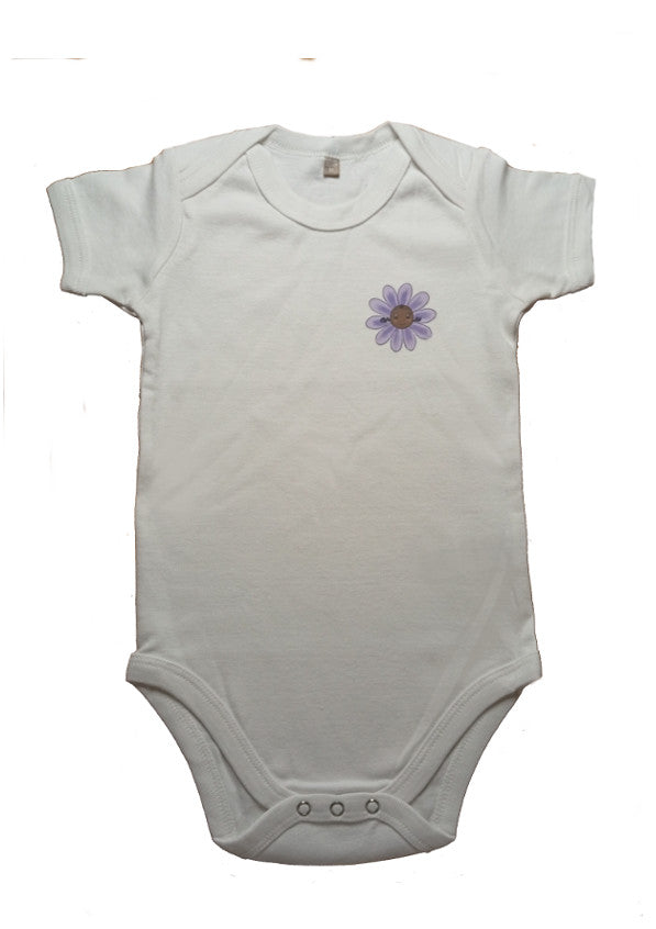 White baby onesie with short sleeves and a small purple flower graphic on the chest