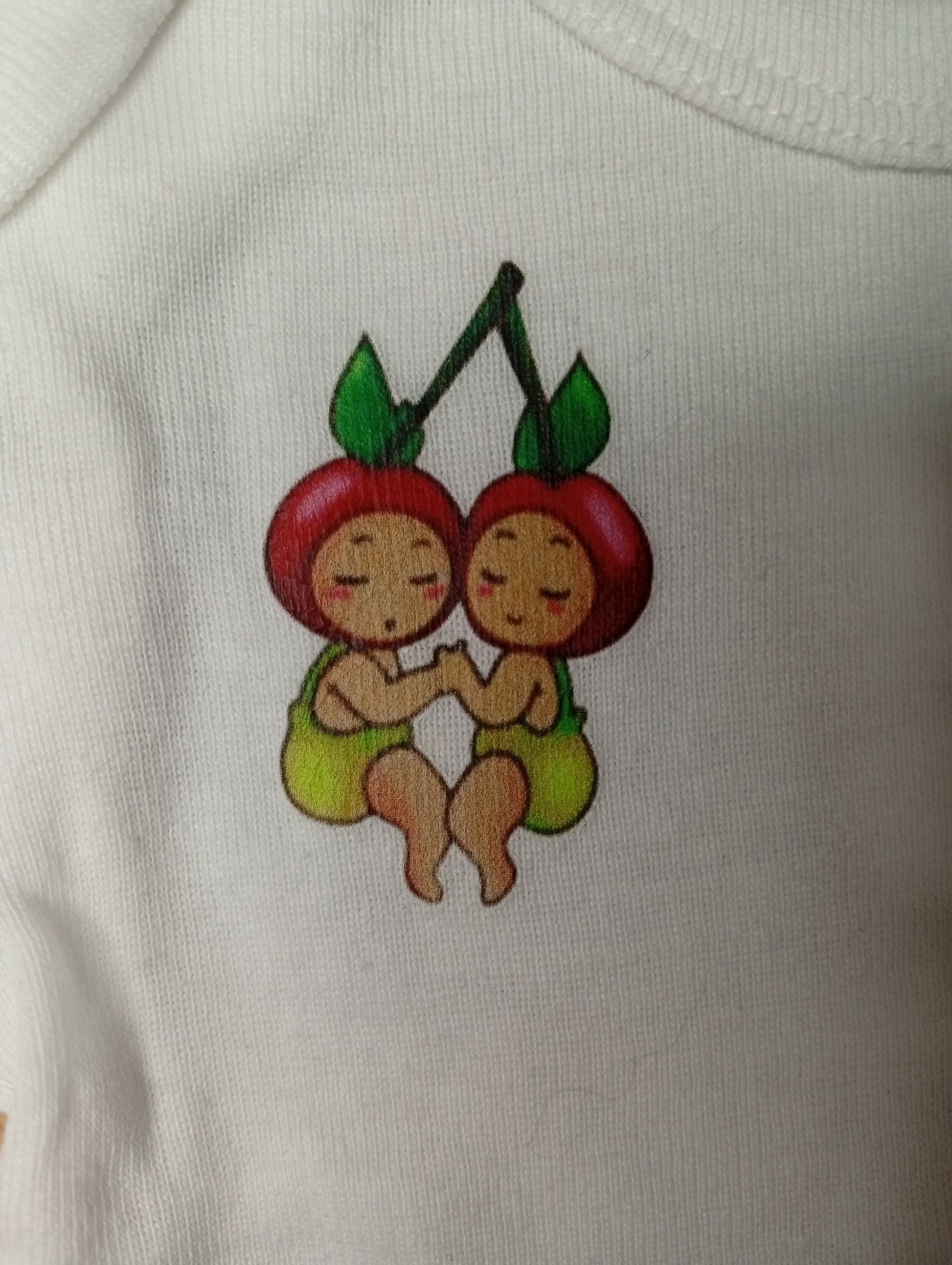 Cute cherry twins illustration on white fabric, baby clothing design