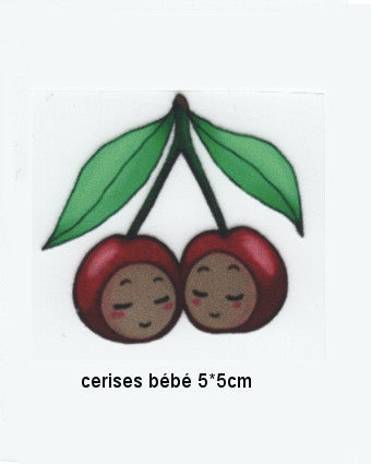 Illustrated motif of two cute cherries with smiling faces and green leaves, labeled 'cerises bébé 5*5cm'.