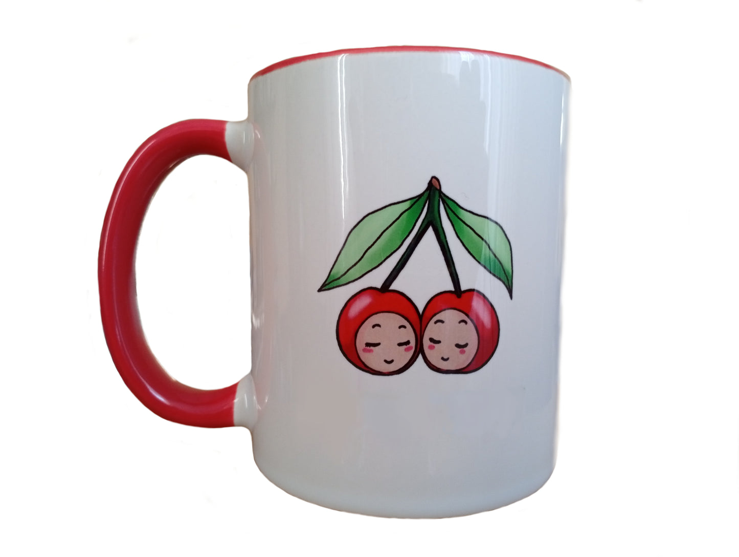 White ceramic mug with red handle and rim featuring cute cherry illustration, isolated background